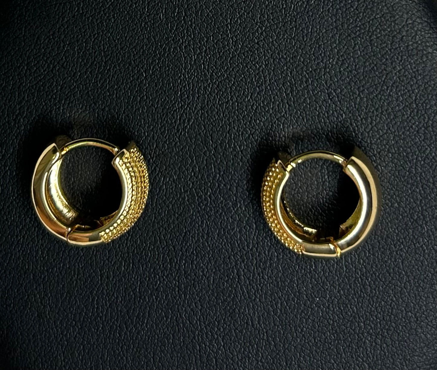 Gold plated hoop earring.