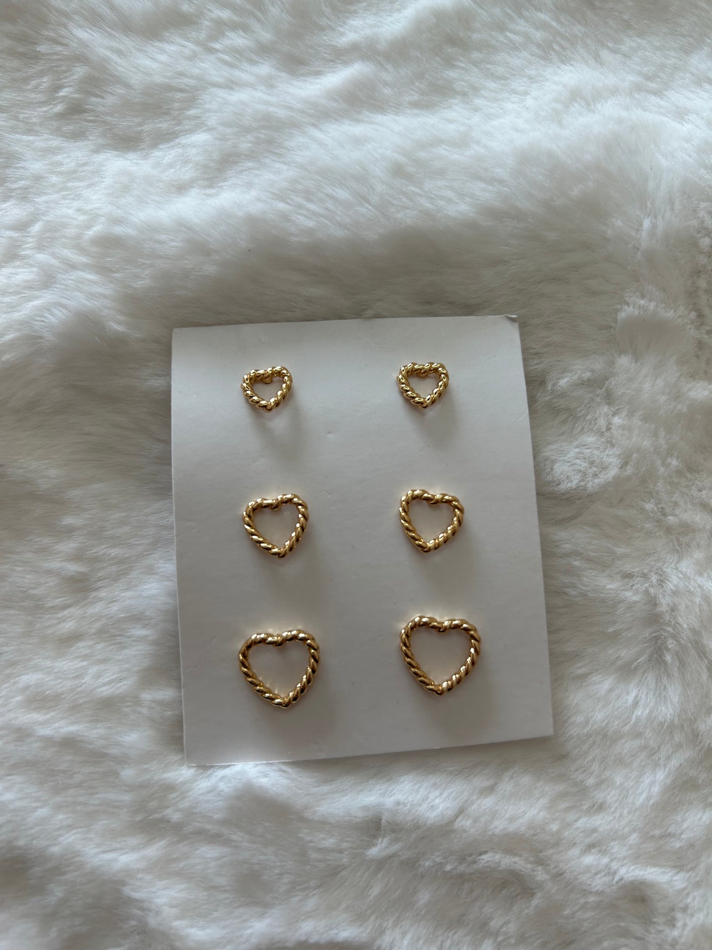 Three-piece earring set with braided heart designs, gold-plated.