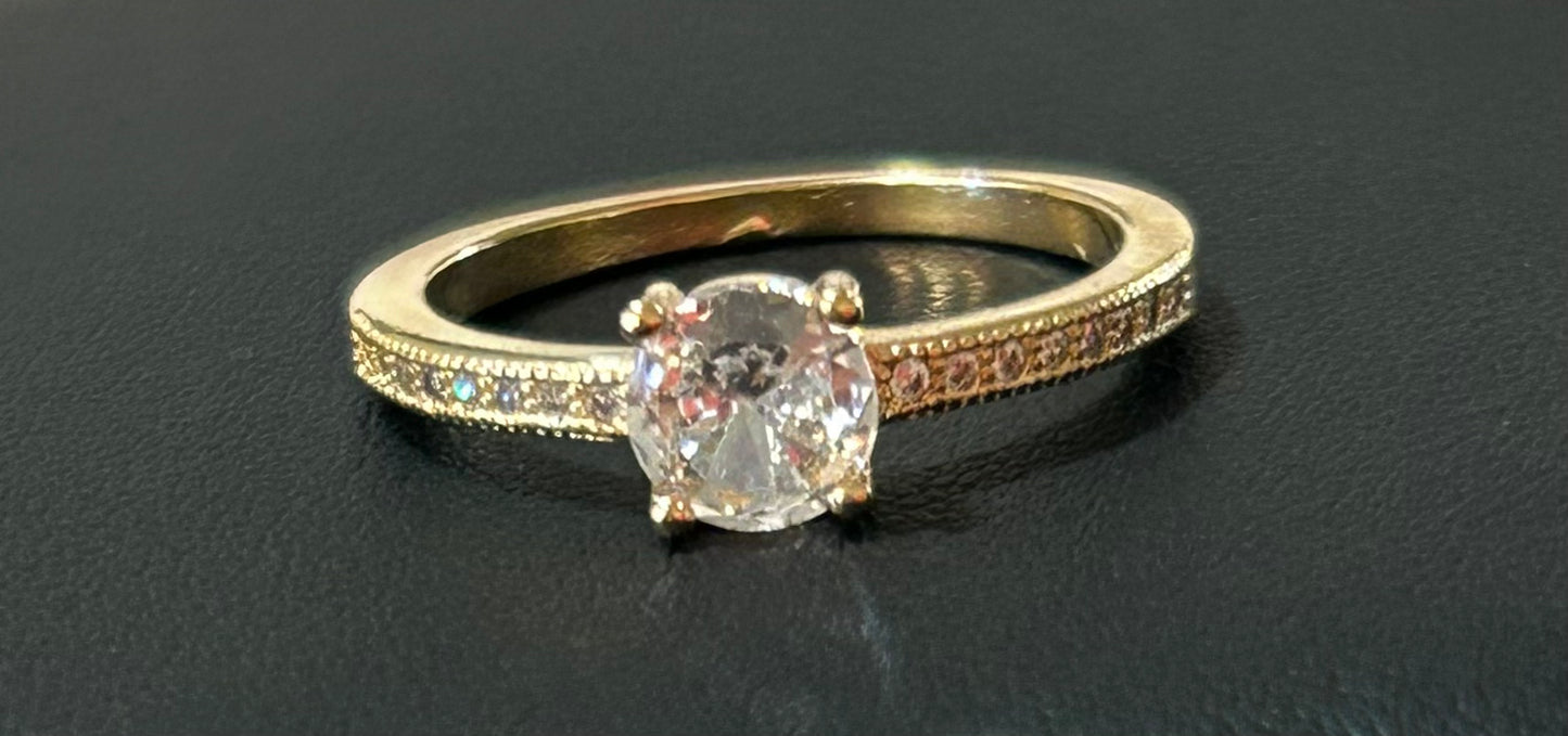 Solitaire ring with gold plated crystal size 7.5